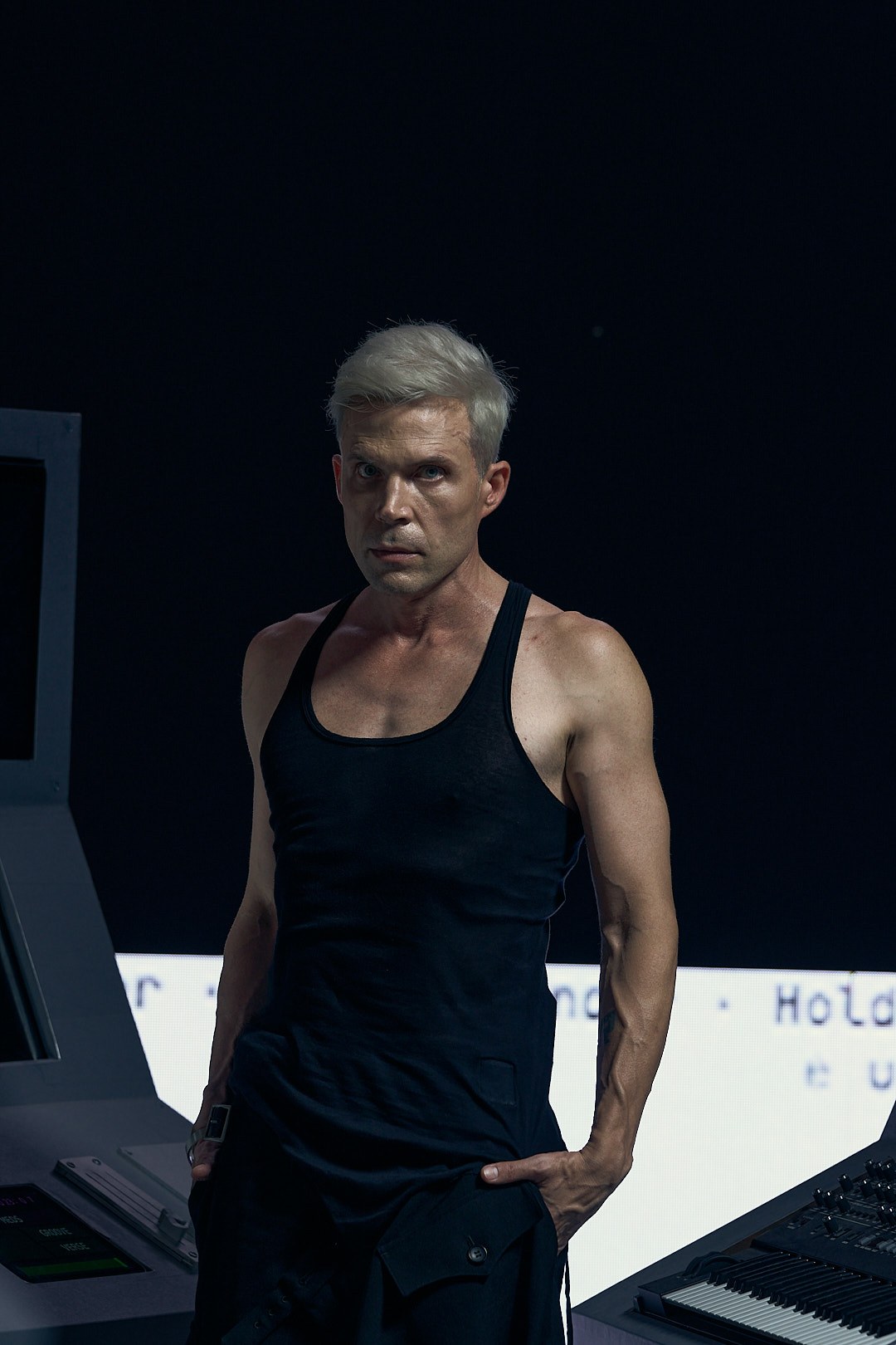 Portrait of M07 beside his custom instruments during SIGNAL filming